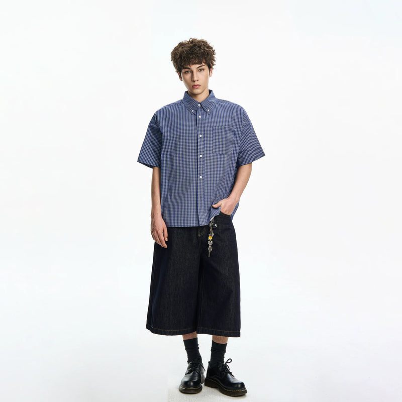 Plaid Dress Shirt on model styled with wide-leg denim shorts