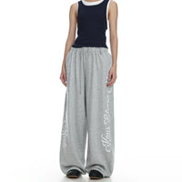Baggy Retro Print Sweats in heather grey on model front view